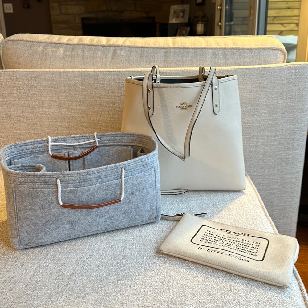 Coach tote with organizer insert and makeup bag.